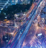 FOREX graph hologram over night busy road traffic in Bangkok, the developed location for stock market researchers in Southeast Asia. The concept of fundamental analysis. Double exposure.
